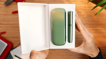 An IQOS ILUMA Holder and Pocket Charger in a box.